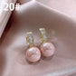 Boucle d'oreille perle classique française, élégante et simple